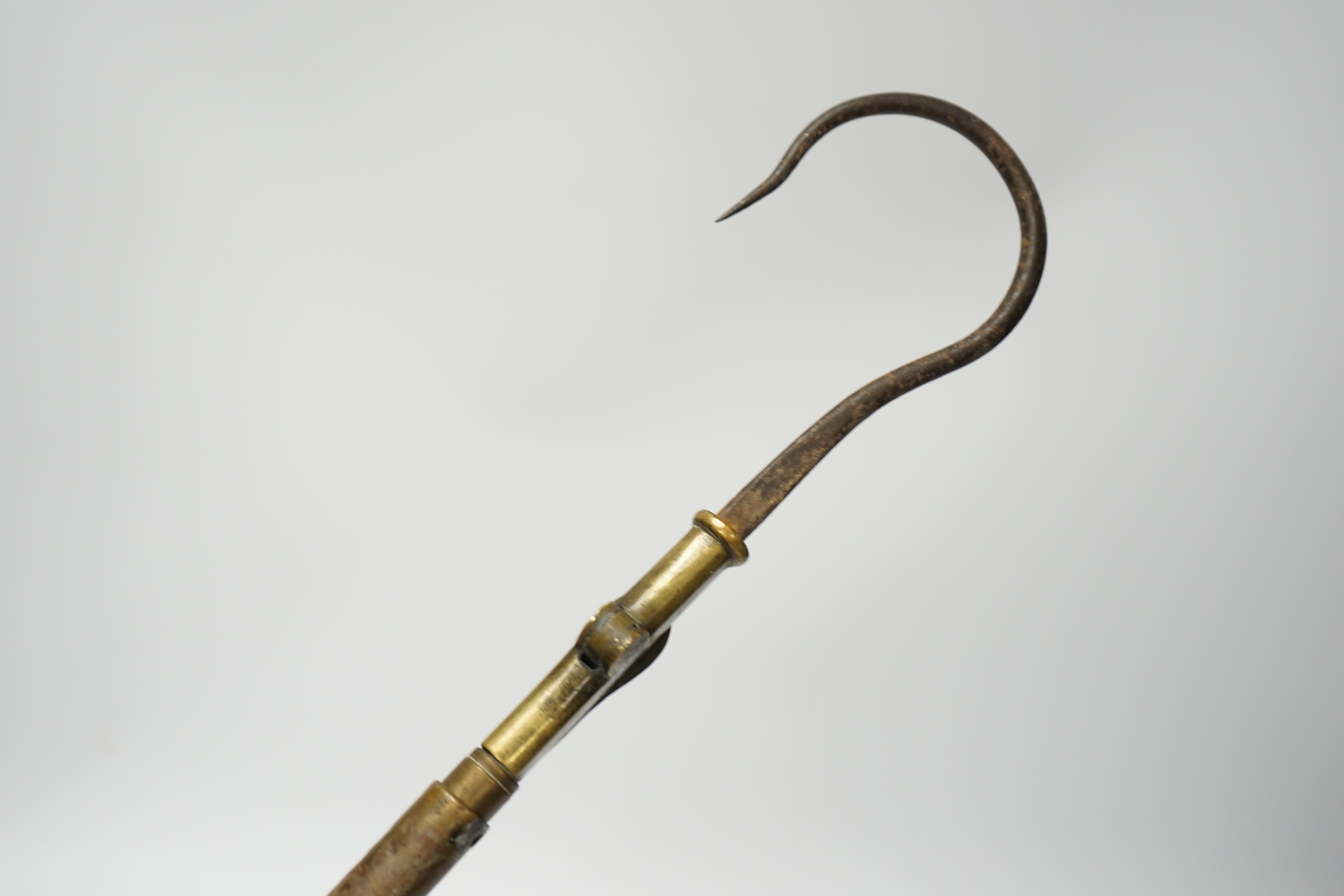 A 19th century folding and extending salmon gaff with cork grip, 58.5cm long. Condition - cork handle damaged one end